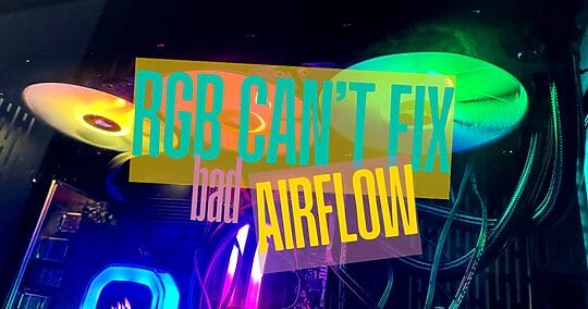 Close-up of a gaming PC’s RGB fan setup showing visible dust buildup on the blades, highlighting poor airflow and common dust issues in improperly ventilated PCs.